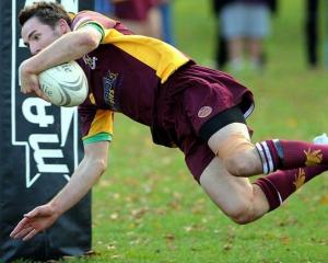 Alhambra-Union fullback Corey McFadzean scores a try during the game against Taieri at the North...