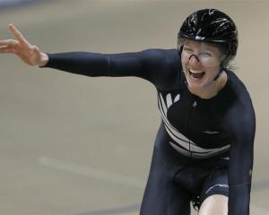 Alison Shanks celebrates winning the women's individual pursuit at the world championships in...
