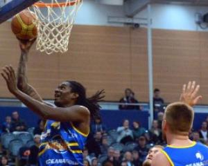 Warren Carter he finds the hoop during the Nuggets' match against the  Canterbury Rams at the...