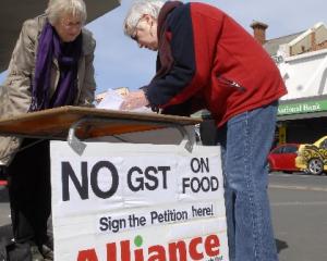 Alliance Party members, from left, Eunice Billot and Gail Marmont collect signatures in South...