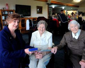 Altrusa Club of Taieri member Glennys Espie (left) with Brooklands Resthome residents Gwenda...