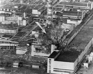 An aerial view of the Chernobyl nuclear power plant. The arrow shows the spot of the accident. A...