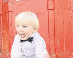 An enthusiastic young guest at the wedding of Angela Walton and Stuart Ellwood, at Outram in...