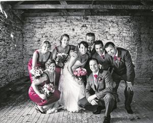 Anna Deans and Colin Lee with their bridal party at their wedding, which took place on Anna's...