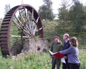 Archaeologist Andrew Winter (left), conservation surveyor Robin Miller and trust member Carol...