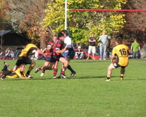 Arrowtown's Ben Chisholm on the charge with captain Aidan Winter in support against Upper Clutha...