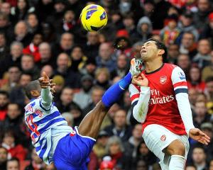 Arsenal's Andre Santos (R) and Queens Park Rangers' Shaun Wright-Phillips challenge for the ball...