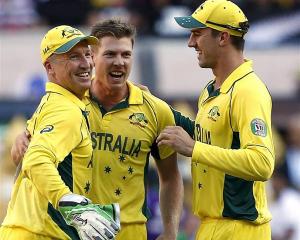 Australia's wicketkeeper Brad Haddin (L) celebrates with team-mates James Faulkner (2nd L) and...