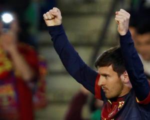 Barcelona's Lionel Messi celebrates after scoring against Real Betis during their Spanish First...