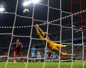 Bayern Munich's Jerome Boateng (not pictured) scores a goal past Manchester City goalkeeper Joe...