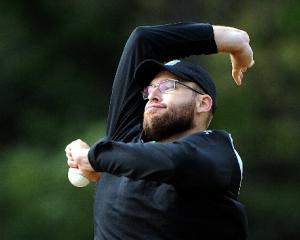 Black Caps all-rounder Daniel Vettori rolls his arm over during team training at the University...