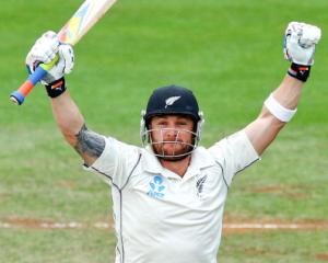 Brendon McCullum celebrates after reaching his triple century. (Photo by Hagen Hopkins/Getty Images)