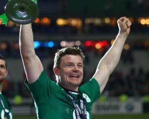 Brian O'Driscoll celebrate with the trophy after Ireland won the Six Nations championship with a...