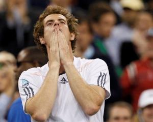 Britain's Andy Murray reacts after defeating Serbia's Novak Djokovic to win the US Open tennis...