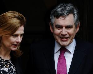Britain's former Prime Minister Gordon Brown and wife Sarah leave the Leveson Inquiry at the High...