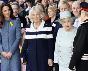 Britain's Queen Elizabeth II, right, Camilla, Duchess of Cornwall, centre, and Kate, Duchess of...