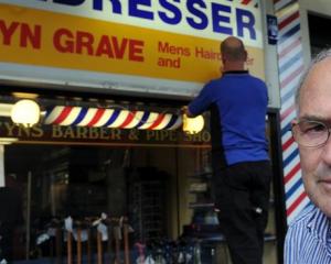 Business owner Selwyn Grave is less than impressed as Miller Studios signwriter Rob Harwood...