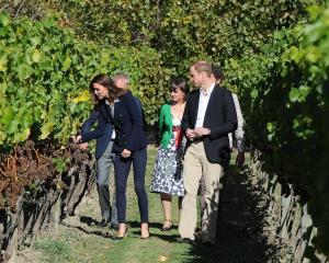Catherine, the Duchess of Cambridge, and Prince William, the Duke of Cambridge, walk through the...