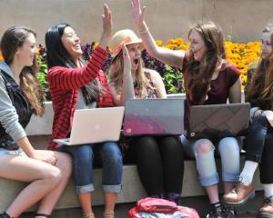 Celebrating their NCEA results in the Octagon yesterday are former Otago Girls' High School...