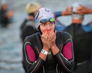 Carrie Lester, from Australia, warms her hands before the start at Challenge Wanaka on Saturday.