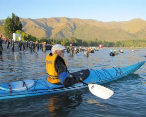Challenge volunteer John Darby watches the swimmers from his kayak. Photos by Mark Price.