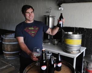 Champion home-brewer Brendan Bransgrove checks the quality of his award-winning Little Jimi...