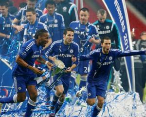 Chelsea players (l-r) Didier Drogba, Cesc Fabregas and Eden Hazard celebrate their team's League...