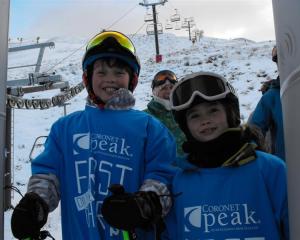 Cougar (left) and Tallulah Bryant proudly wear their special T-shirts after being first on the...