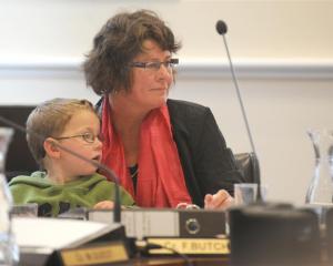 Cr Fliss Butcher and her grandson, Rafferty Jarman-Shirkey (3), listen to submissions at the...