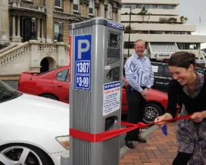 Cr Jinty McTavish cuts the ribbon on the council's new solar-powered ticketless parking meter,...