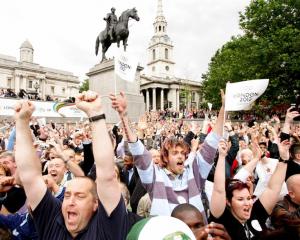 Crowds in London's Trafalgar Square celebrate as the announcement is made that London will host...