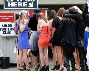 Crowds queue to join the punters club at Wingatui yesterday. Photo by Peter McIntosh.