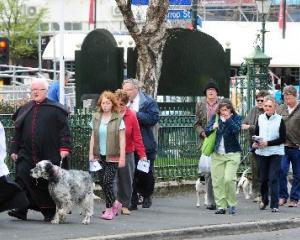 Crucifer Margaret Harding and the Very Rev Dr Trevor James led yesterday's pet procession before...