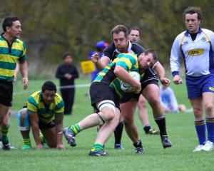 Daniel Johnson tackles Green Island prop Simon McCarthy.