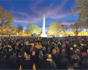 Dawn breaks over the cenotaph in Dunedin as a large crowd commemorates Anzac Day. Photo: Gerard O...