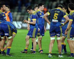 Dejected Otago players on the field following their 41-0 loss to Hawkes Bay in Napier on Sunday. ...