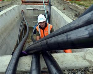 Delta civil construction worker Julian Corkill installs cables under Portsmouth Dr. Photo by...