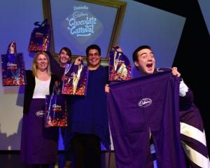 Dominic Tay (right), dressed as Cadbury Joyville character Derek Valentine, celebrates the launch...