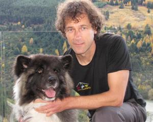 Dr Geoff Woodhouse, of Remarkable Vets Arrowtown, with Gypsy, the 3-year-old Japanese Akita dog...