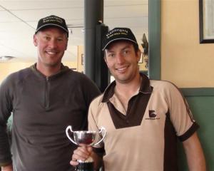 Dunedin man Guy Wilson holds the King of the Hill trophy he won during Sunday's third Black Gold...