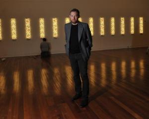 Dunedin Public Art Gallery curator Aaron Kreisler stands amid  the 'Te Po' exhibition while ...