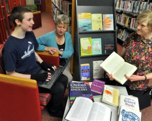 Dunedin writer Rowan Stanley (21) types on a laptop, with literary assistance from librarians...