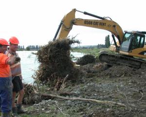 Duntroon farmer Geoff Keeling (right) manages a joke with Environment Canterbury river engineer...