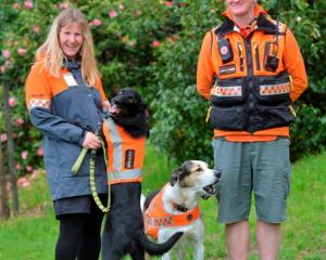 Emma Milburn with Dart, who is now Dunedin's fourth operational LandSAR dog, along with Fin and...