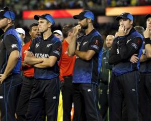 End of the dream . . . New Zealand players watch the presentation ceremony after their loss in...