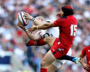 England's Mike Brown (L) challenges Wales' Leigh Halfpenny. REUTERS/Stefan Wermuth
