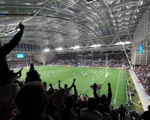 Fans cheer on England and Argentina at a packed Otago Stadium on Saturday night. Photo by Stephen...