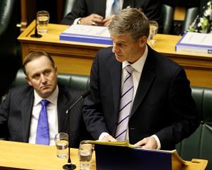 Finance Minister Bill English reads his 2012 Budget in the House today. Photo NZ Herald