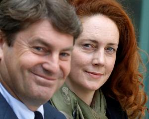 Former News International chief executive Rebekah Brooks and her husband Charlie Brooks leave...