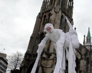 Four-leg stilt walker Rhys Latton practises his spider act ahead of the Midwinter Carnival this...